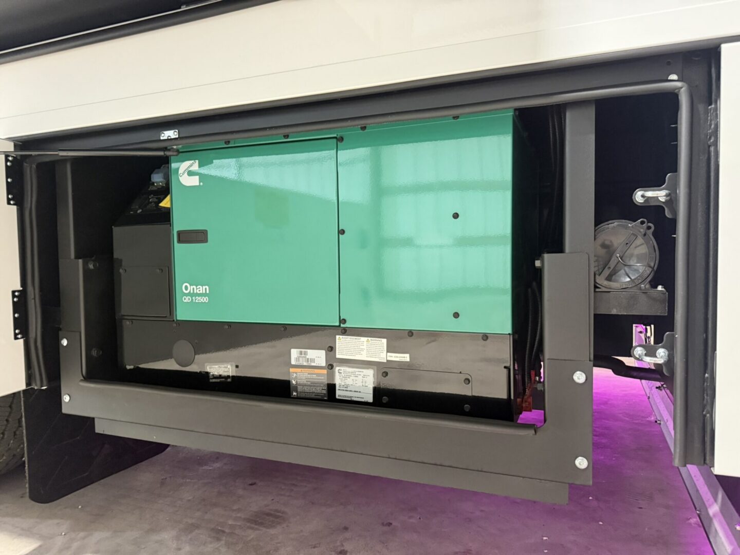 Onan generator installed in RV compartment.