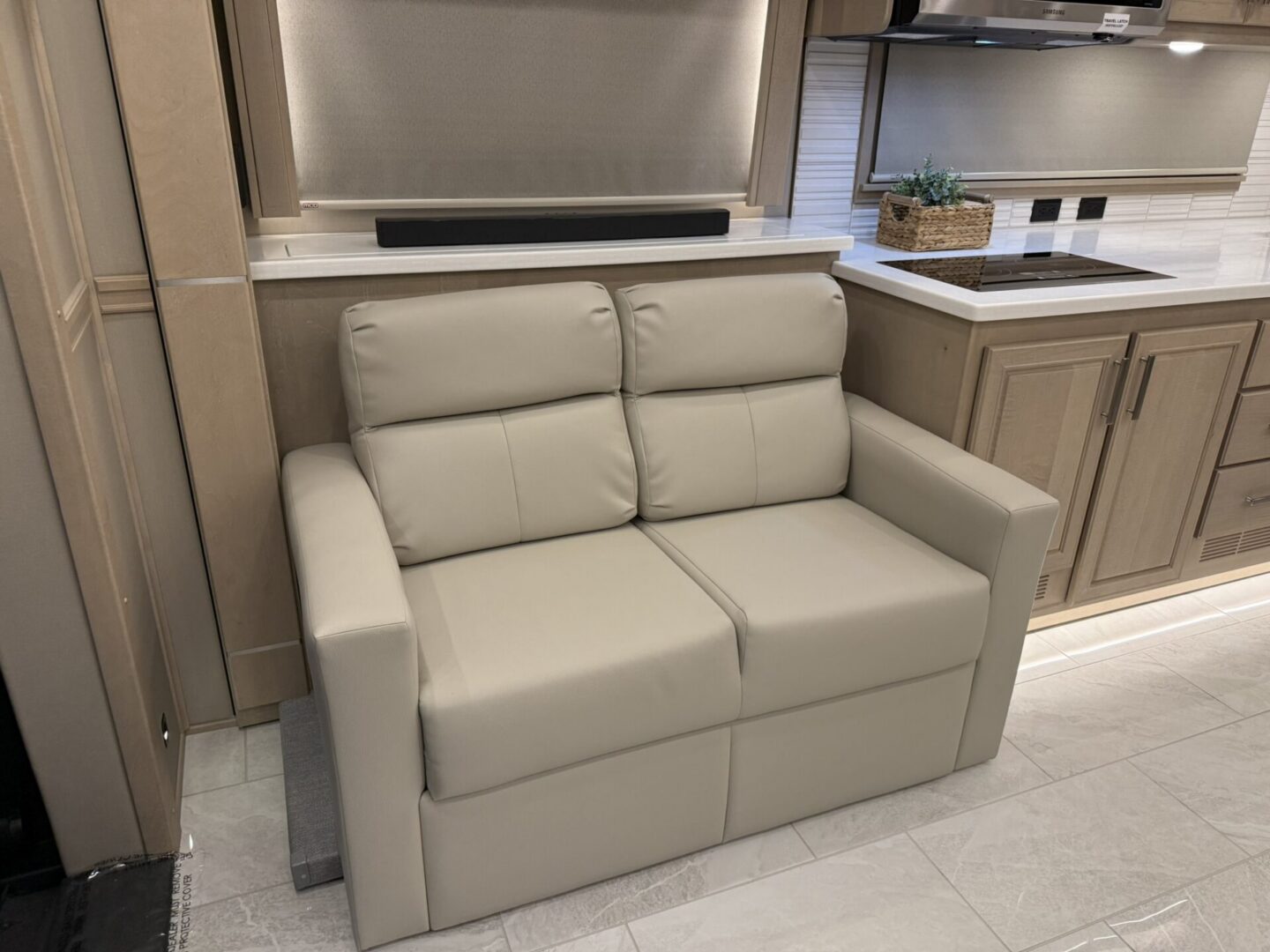 Modern beige loveseat in a stylish kitchen.