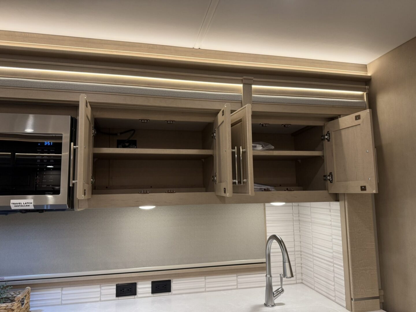 Open kitchen cabinets with modern design.