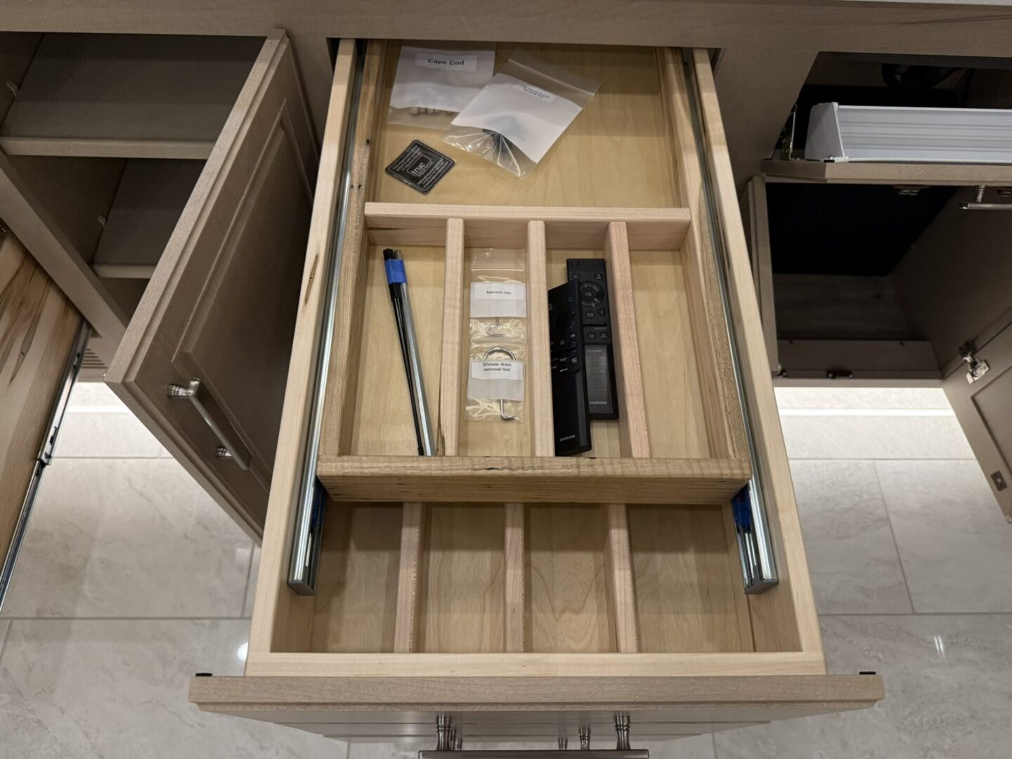 Empty kitchen drawer with organizing compartments.