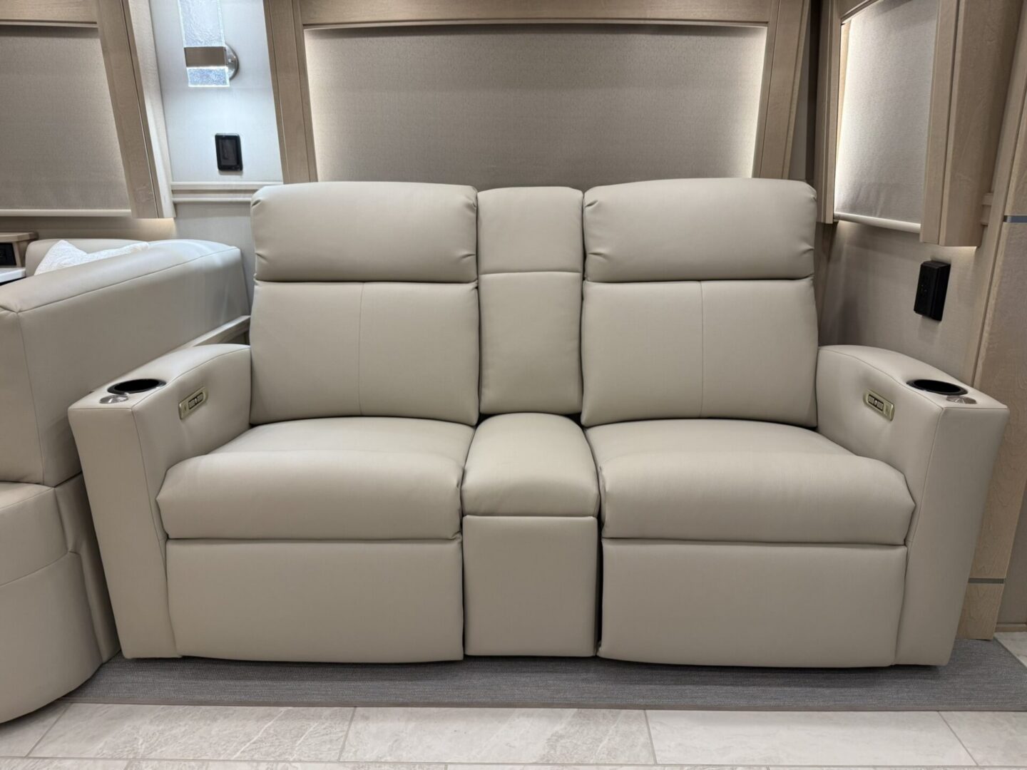Modern cream leather reclining sofa set.