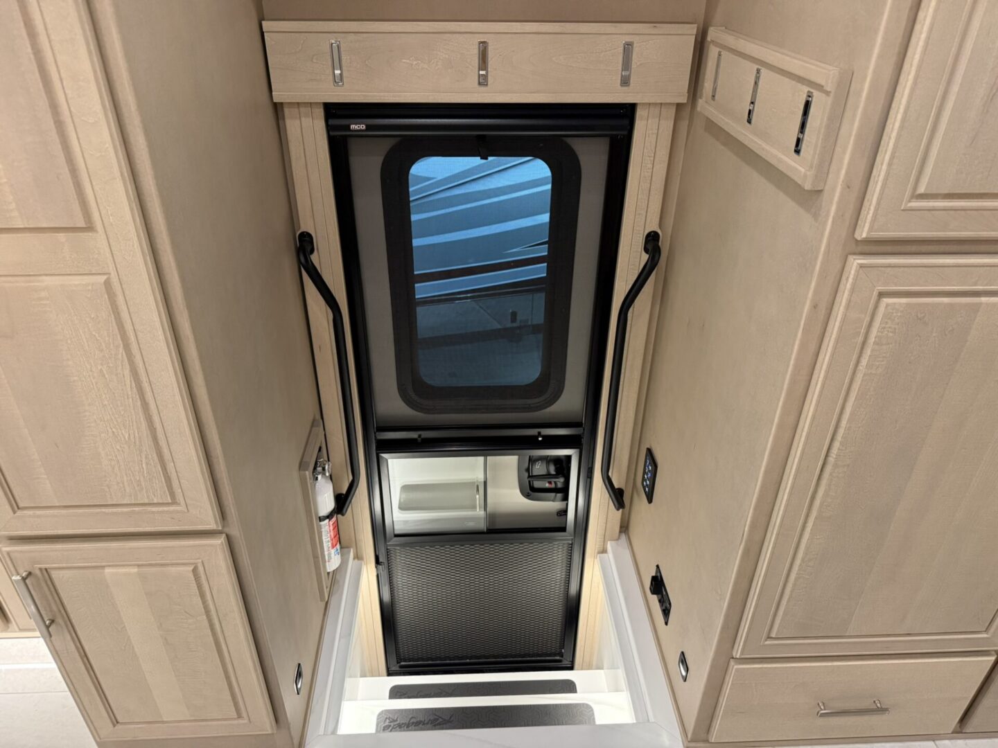 Interior view of a camper door entrance.