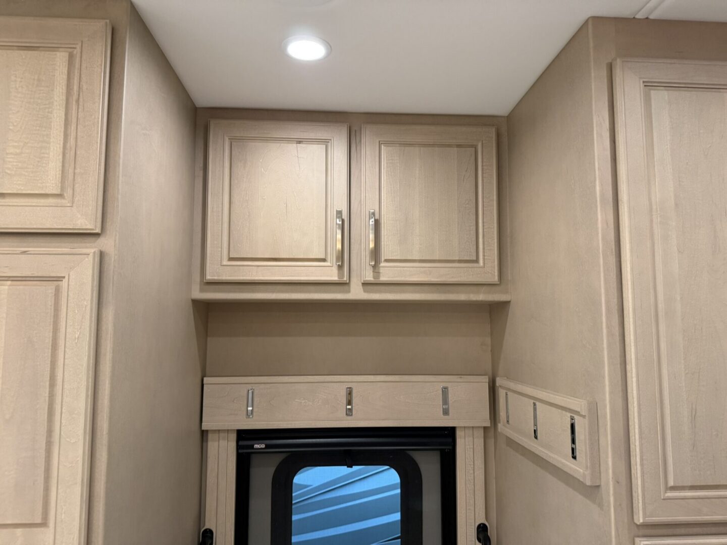 Modern kitchen cabinetry with overhead storage.