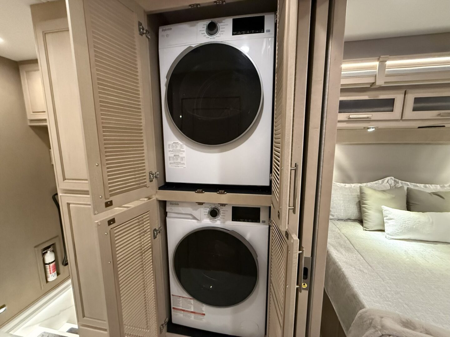 Stacked washer and dryer in compact space.