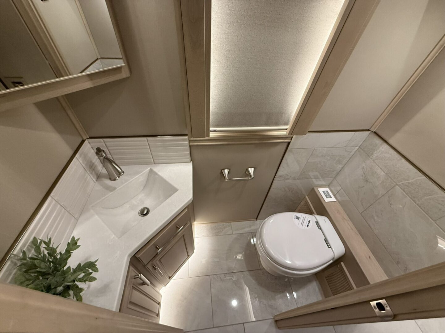 Modern bathroom with toilet and sink.