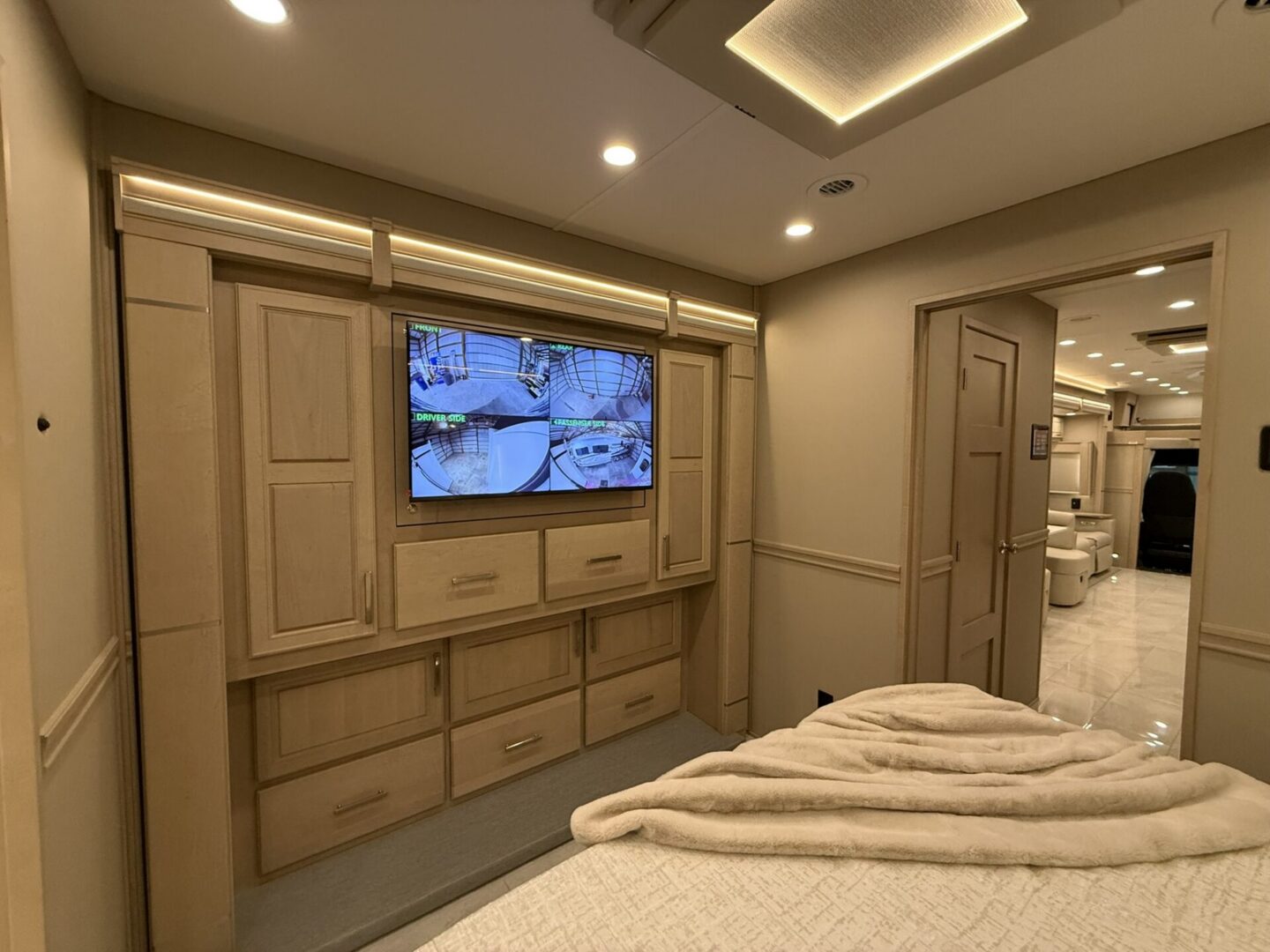 Cozy bedroom with TV and elegant decor.