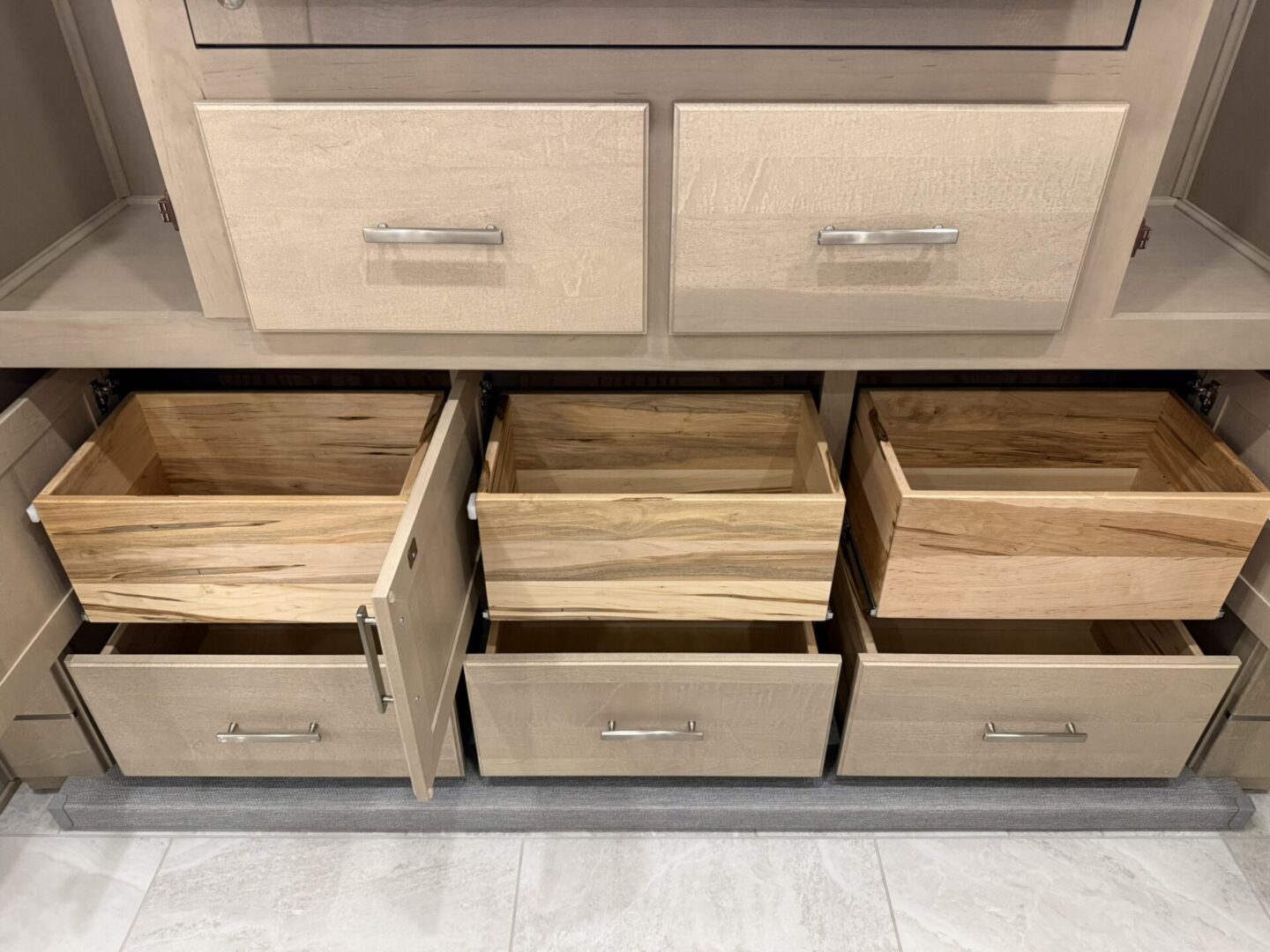 Wooden drawers in a modern cabinet.