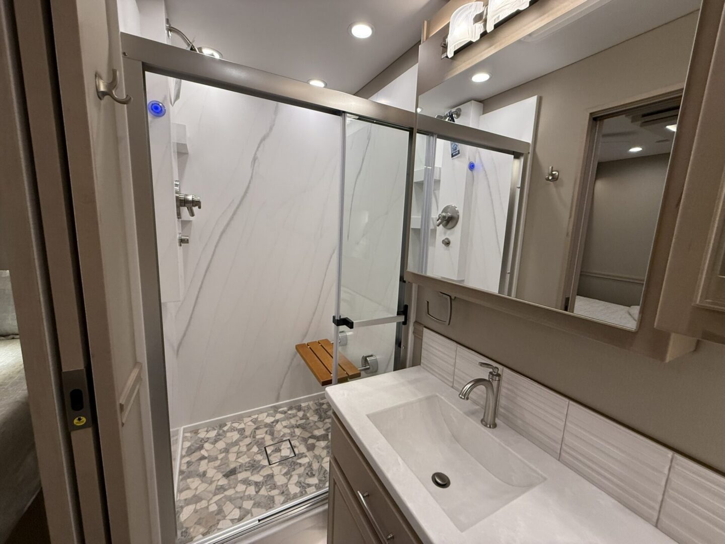 Modern bathroom with glass shower enclosure.