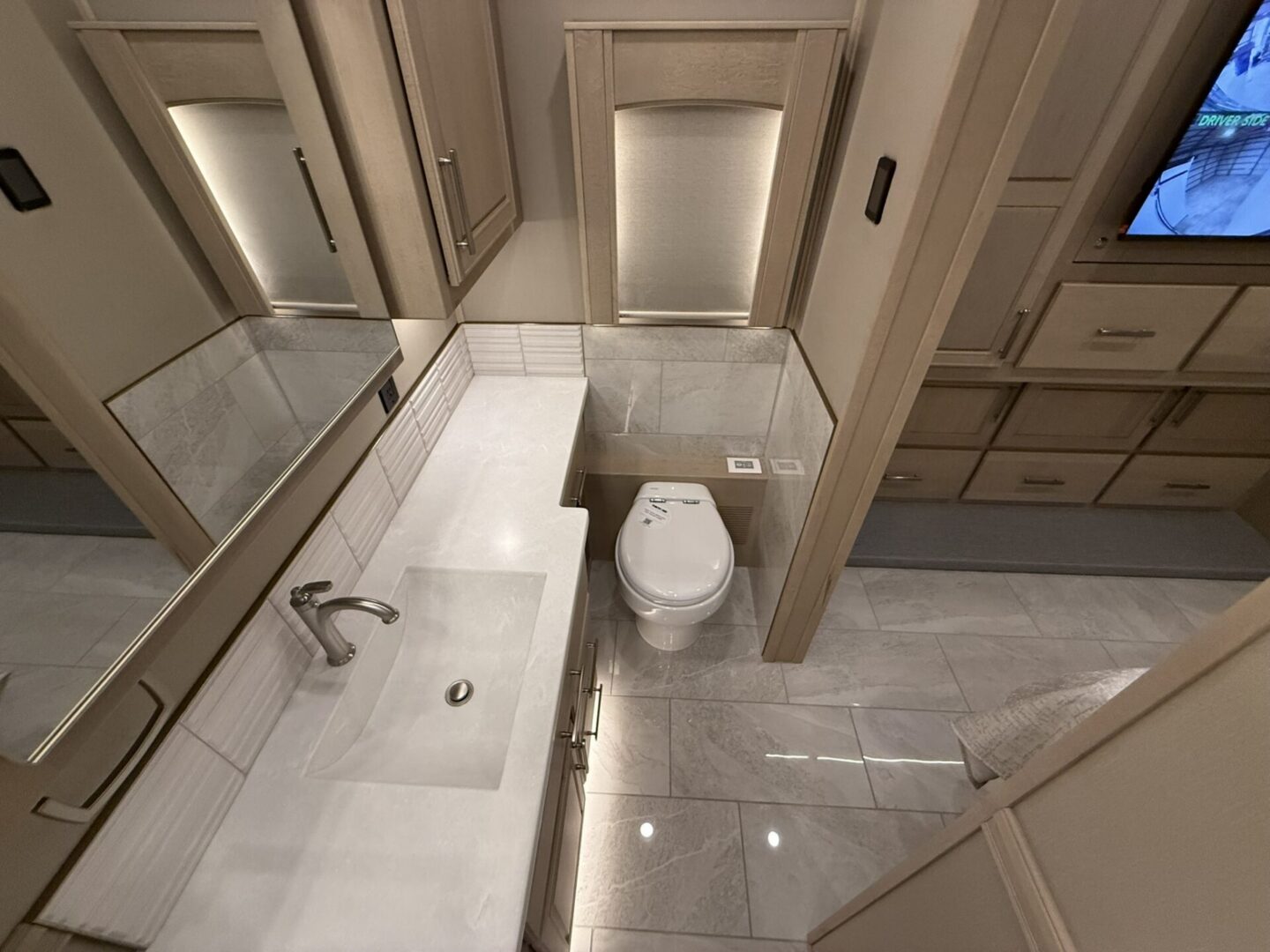 Modern bathroom with sleek fixtures and mirrors.