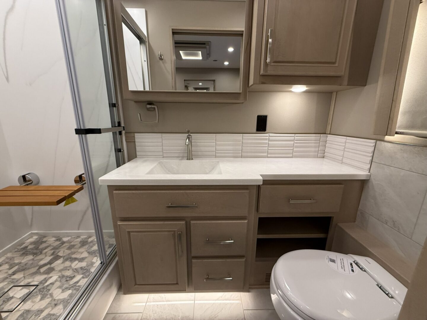 Modern bathroom with shower and vanity.