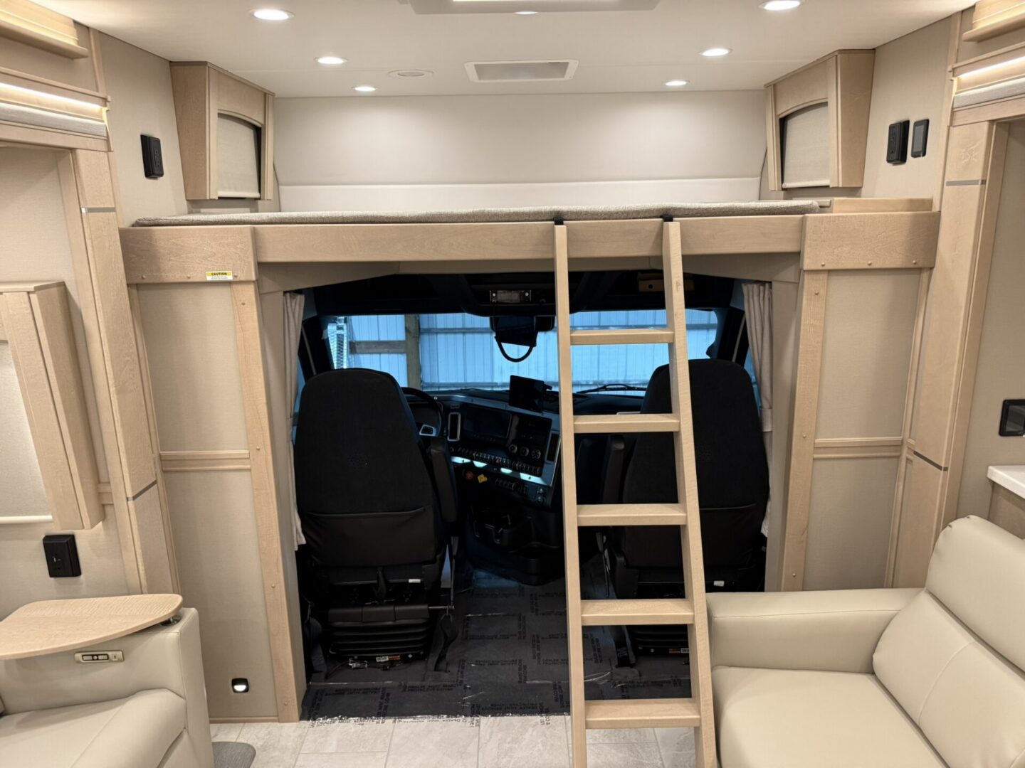 Interior of a modern RV with ladder.